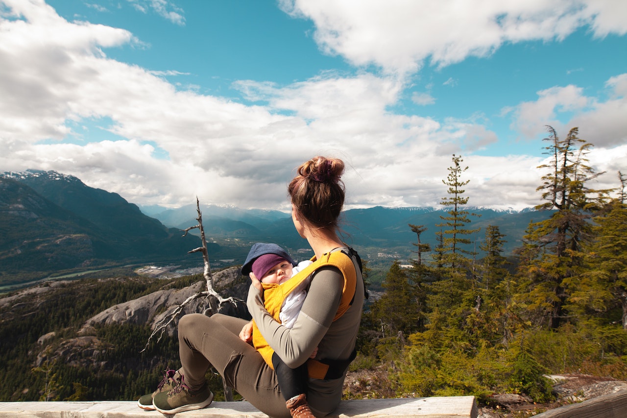 mother hiking with baby in baby carrier